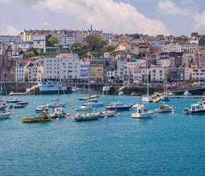 houses on st peter port on a summer day
