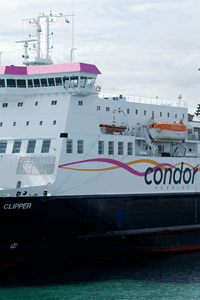 commadore clipper moored in a harbour on a cloudy day