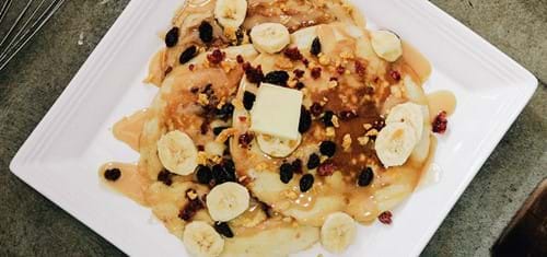 crepes in st malo with toppings on white plate