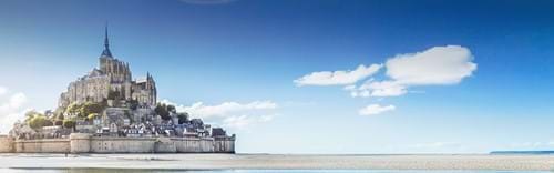 view of mont saint-michel normandy in france with blue skies